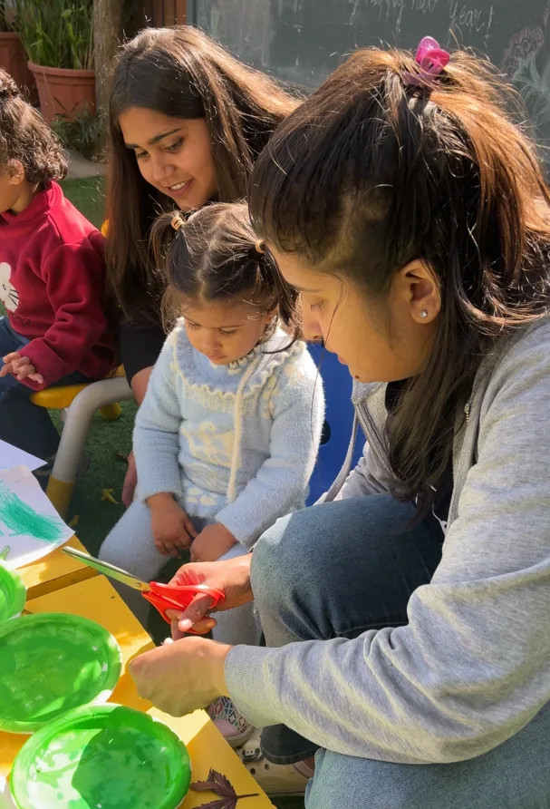A mother and her toddler playing side by side at a Mother Toddler session