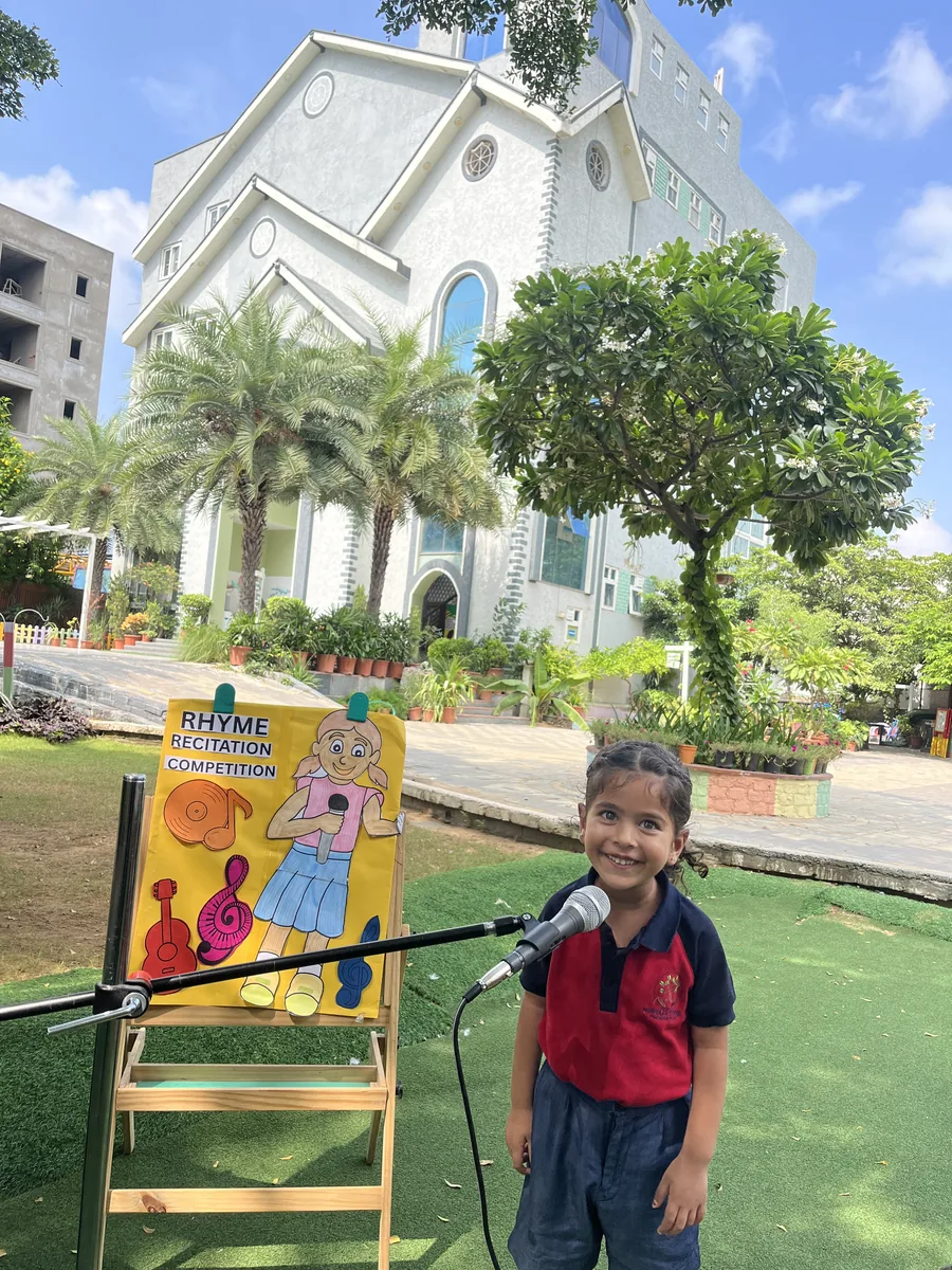 A child reciting a rhyme in front of the class