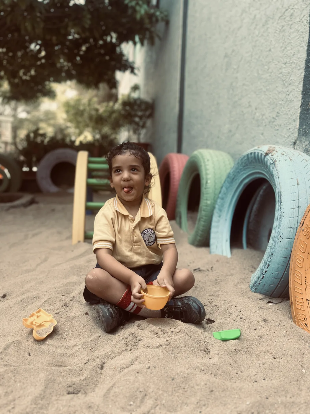 A toddler exploring sensory play materials
