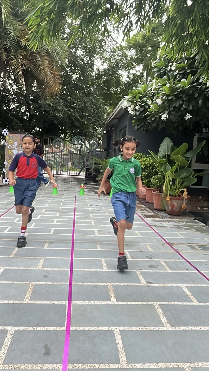 Children running a race on the school grounds