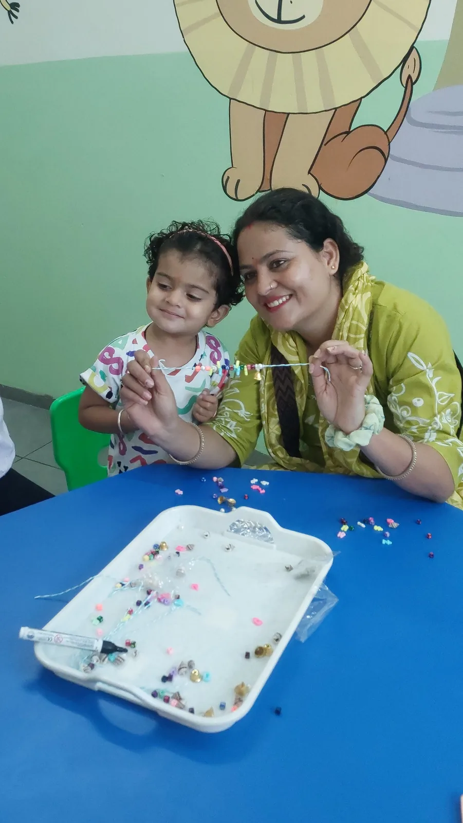 A toddler busy with an age-appropriate brain-play activity
