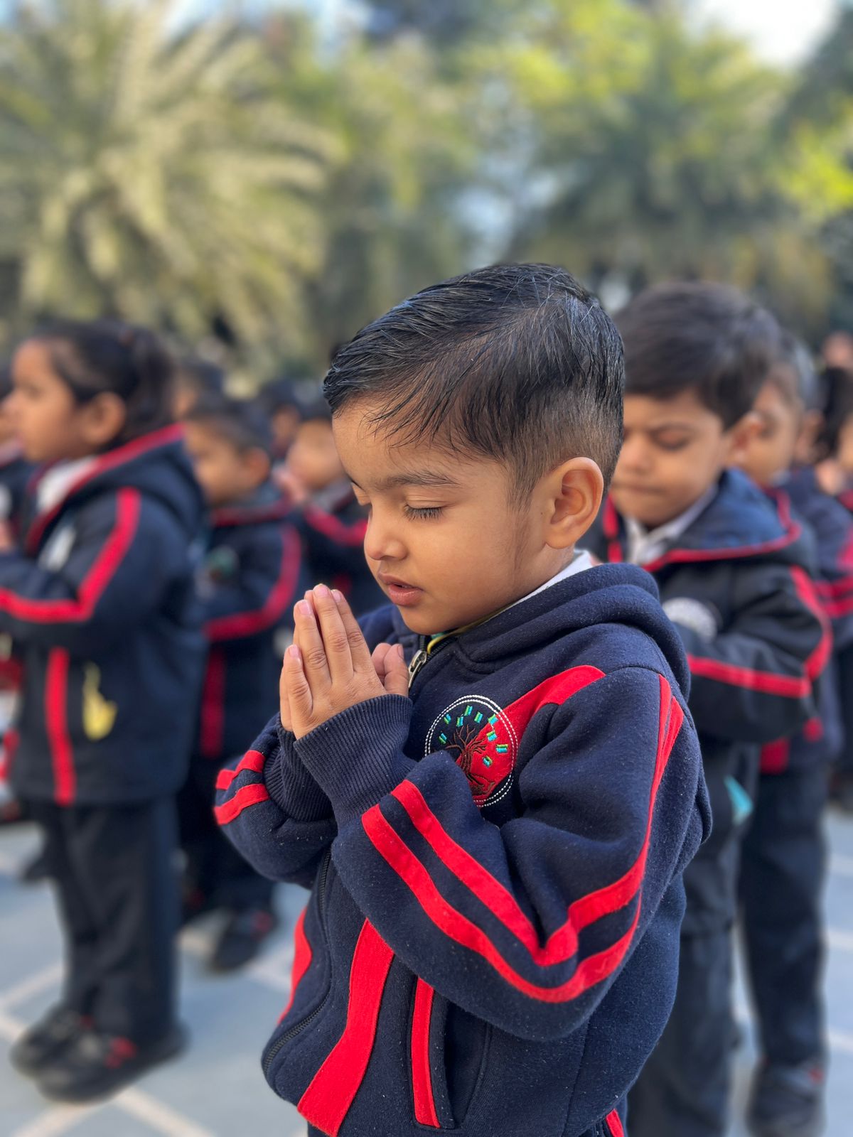 Children gathering for morning prayer outdoors