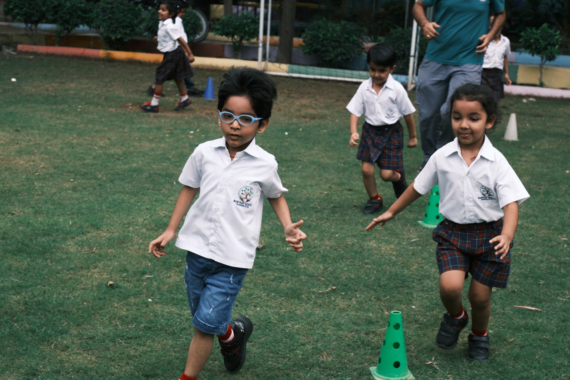 Toddlers running happily on the school grounds