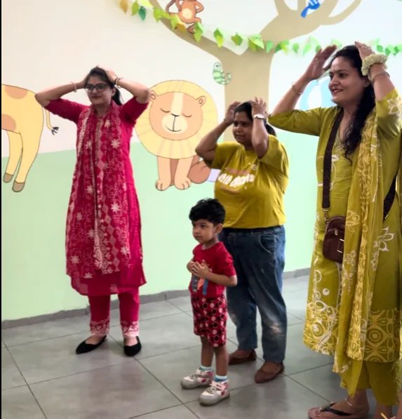 Toddlers joining in songs, stories and movement